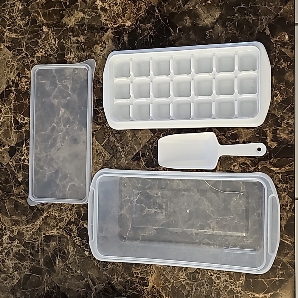 Mini plastic ice cube tray with basket and scooper and lid.